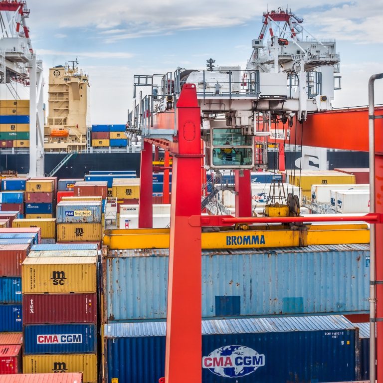 Buenos Aires, Argentina - December 17, 2012: Containers operation in the Port of Buenos Aires, Argentina. The Port of Buenos Aires is the principal maritime port in Argentina. It is the leading transshipment point for the foreign trade of Argentina.